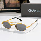Gold round sunglasses with dark lenses, pearl chain detail on temples