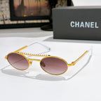 Gold round sunglasses with rose-tinted lenses, pearl chain on temples