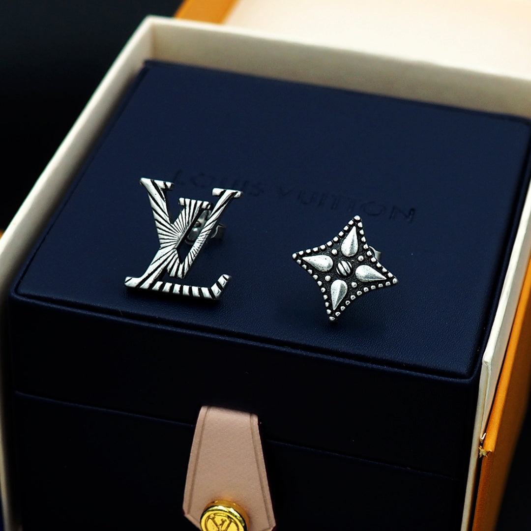Louis Vuitton accessories: silver stud earrings in navy box insert with ribbon tag