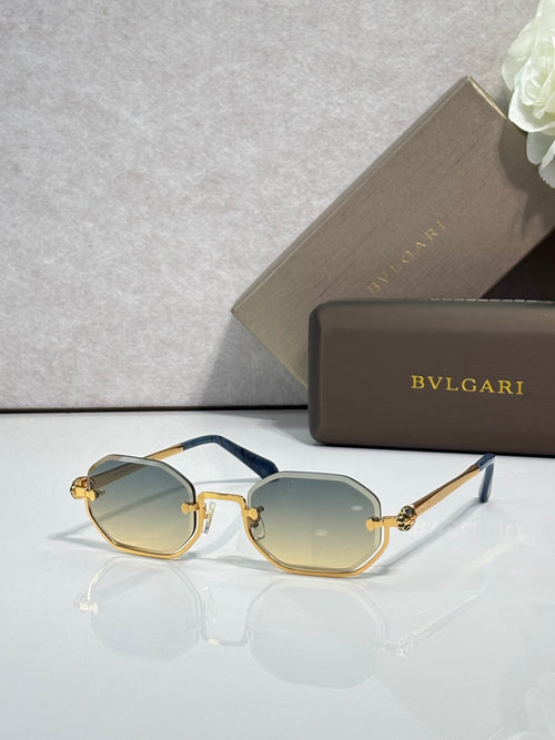 Sunglasses with light blue lenses and gold metal frame, dark blue temple tips