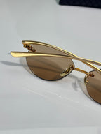 Bottega Veneta gold-tone glasses with brown lenses, temple bar view
