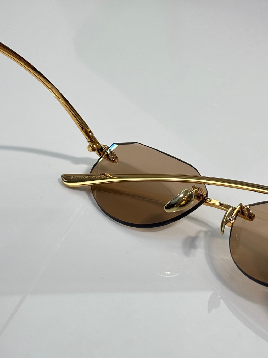 Bottega Veneta gold-tone glasses with brown lenses and curved temple