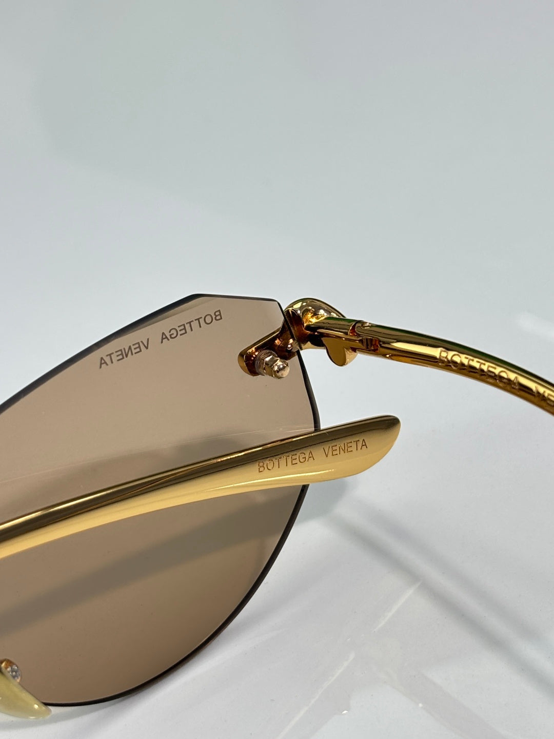 Bottega Veneta gold-tone glasses with brown lenses, logo on arm