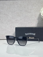 Chrome glasses with dark frames and clear-tinted lenses, visible metal bar on side