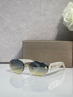 Sunglasses with gradient lenses, white temples, and gold-tone logo hardware