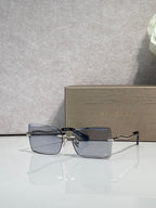 Bvlgari rectangular sunglasses with gold frame and gray-blue lenses