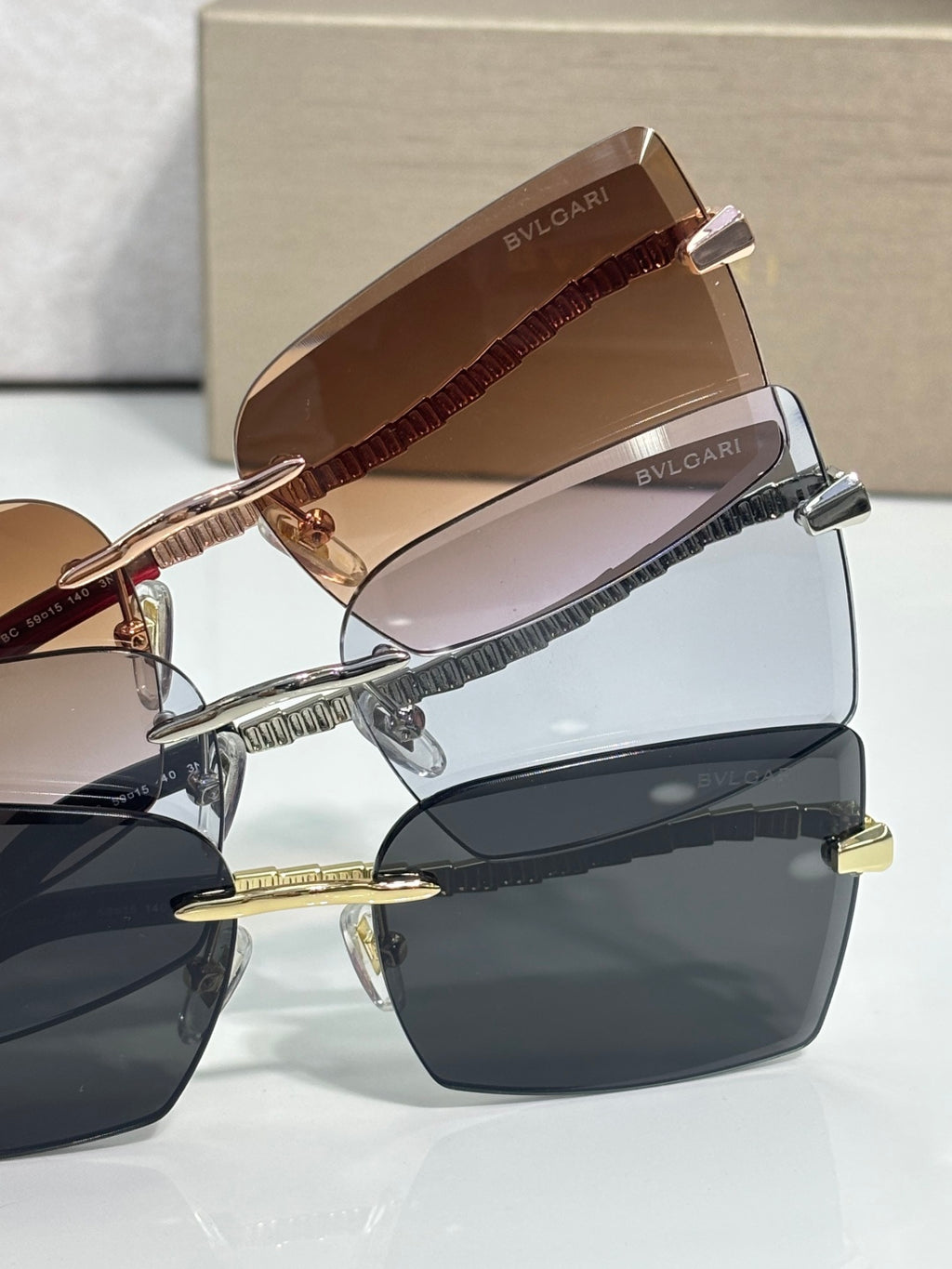 Bvlgari sunglasses side view with rose-gold frame and tinted lenses
