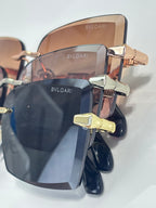 Bvlgari sunglasses close-up with bronze frames and dark lenses
