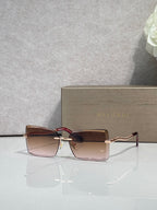 Bvlgari rectangular sunglasses with gold frame and pink-tinted lenses