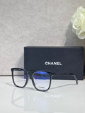 Chanel glasses with dark blue acetate frames and blue lenses, metal logo accents.