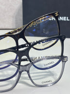 Chanel glasses close-up of blue-tinted lenses with metal temple logo