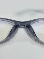 Chanel eyeglass frames close-up, glossy dark blue acetate with shaped bridge