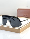 Shield sunglasses with black frame and dark blue gradient lenses