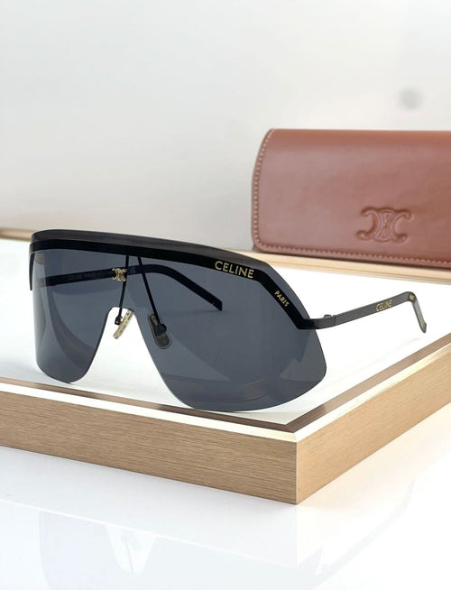 Shield sunglasses with black frame and dark blue gradient lenses