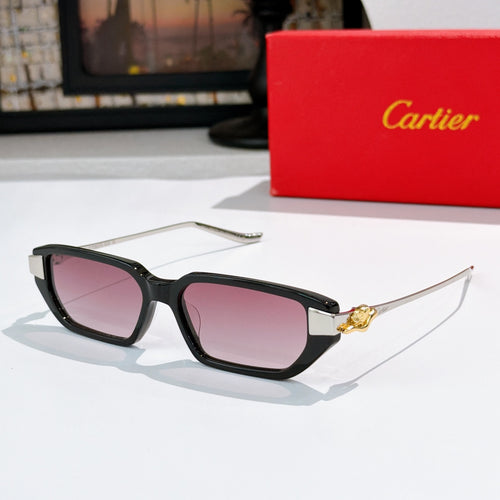 Black sunglasses with pink-tinted lenses and gold-tone temple details