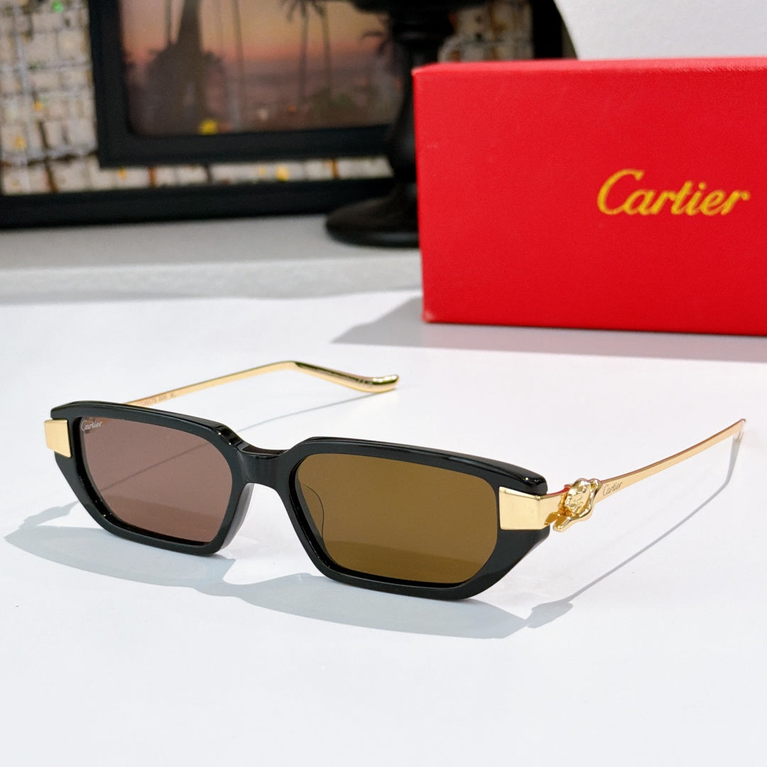 Black sunglasses with amber lenses and gold-tone centerpiece