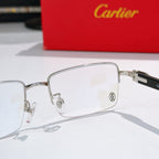 Cartier eyeglasses with silver frame and clear lenses, front close-up detail.