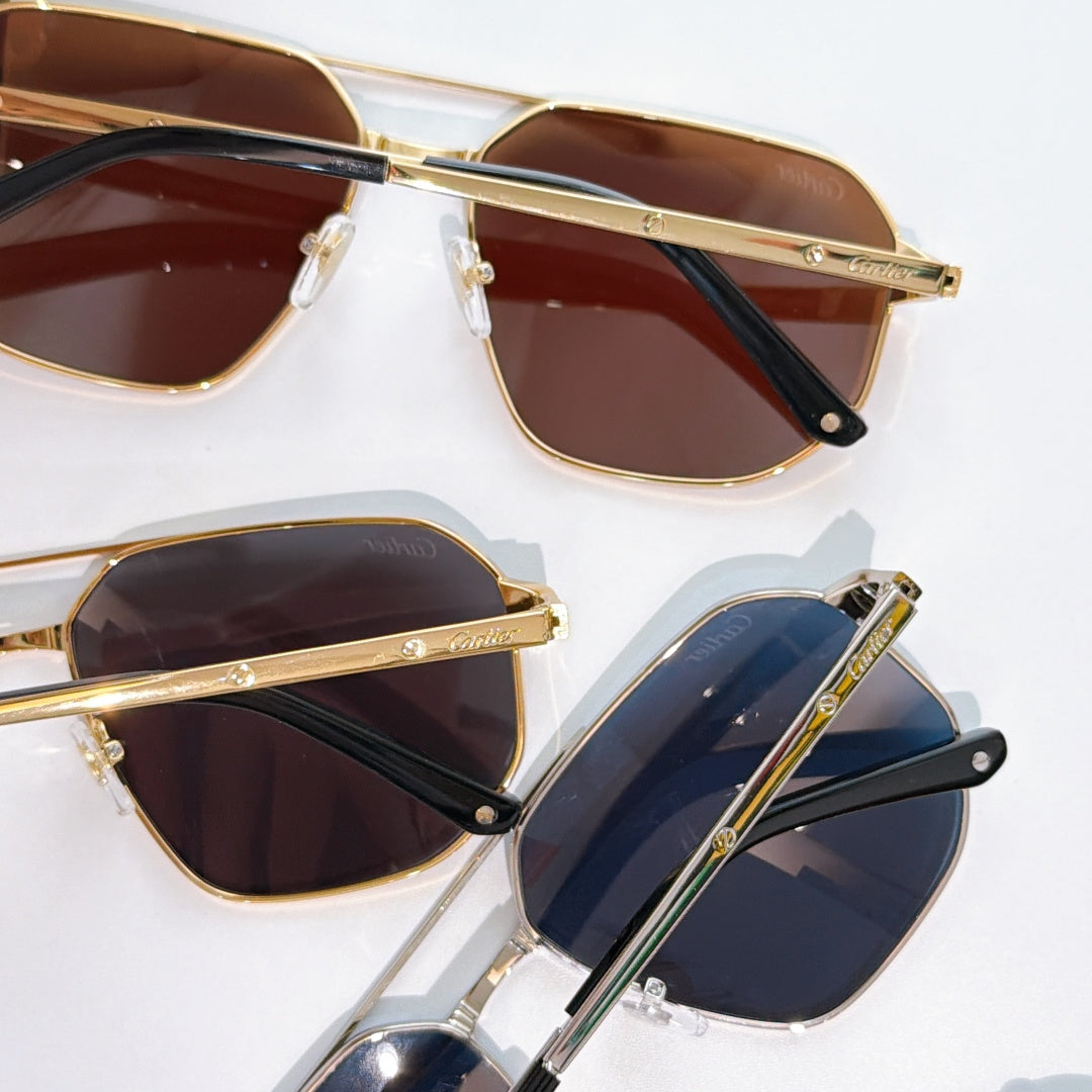 Cartier sunglasses close-up: gold frame with brown lenses, black temple hinges.