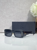 Dior sunglasses with dark blue frame and smoky gray square lenses