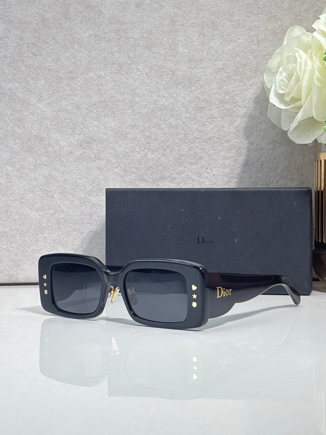 Dior sunglasses with dark blue frame and smoky gray square lenses