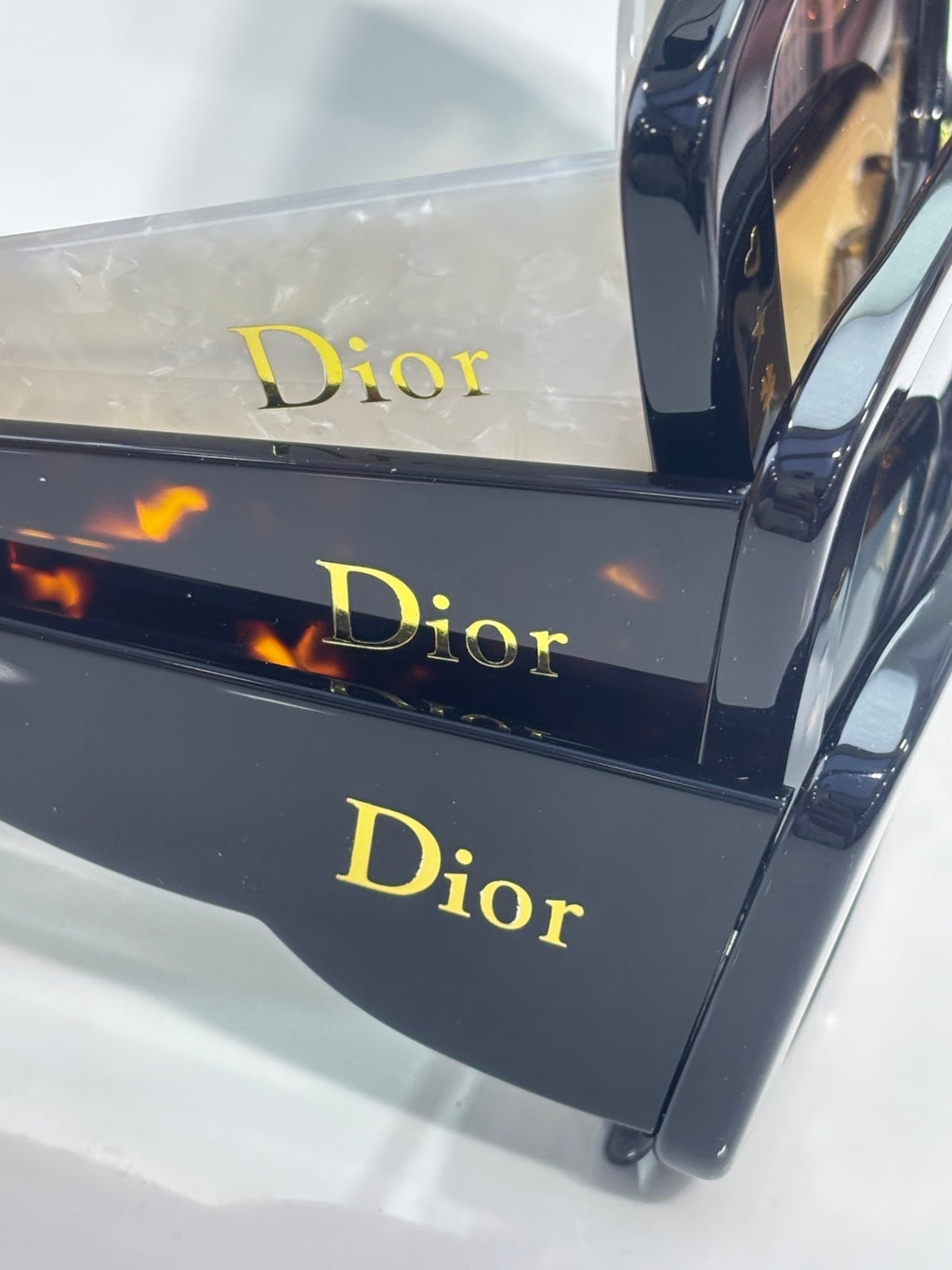 Dior sunglasses in a display box with Dior logo