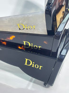 Dior sunglasses in a display box with Dior logo