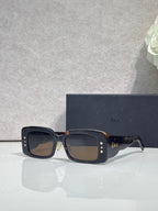 Dior sunglasses with dark tortoiseshell frame and brown gradient square lenses