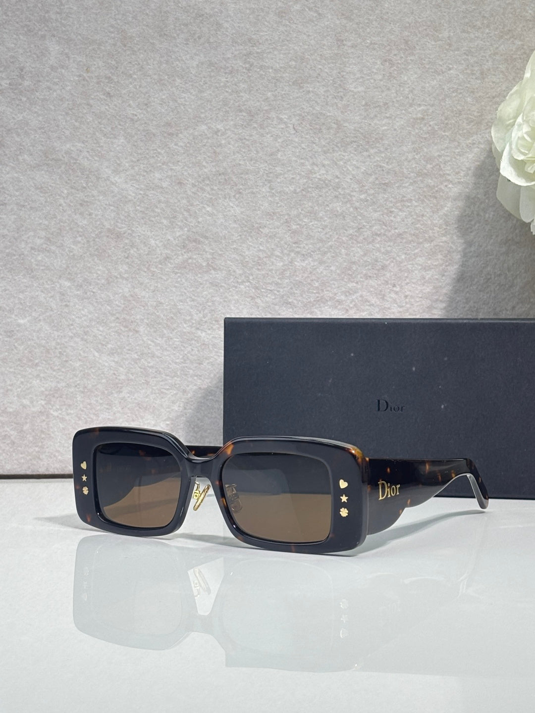 Dior sunglasses with dark tortoiseshell frame and brown gradient square lenses