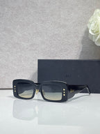 Dior sunglasses with dark navy frame and smoky square lenses