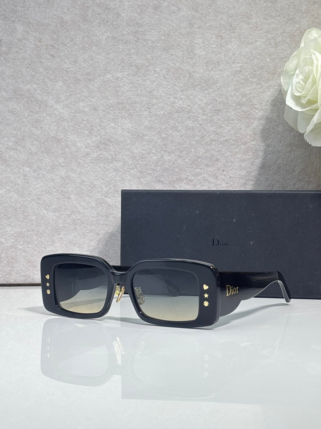 Dior sunglasses with dark navy frame and smoky square lenses