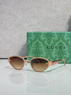 Cat-eye sunglasses with rose-gold frames and warm gradient lenses