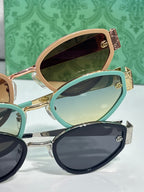 Cat-eye sunglasses set with teal, rose-gold, and dark frames and tinted lenses