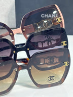 Chanel sunglasses close-up of lenses and pink frame with gold logo and hinge details