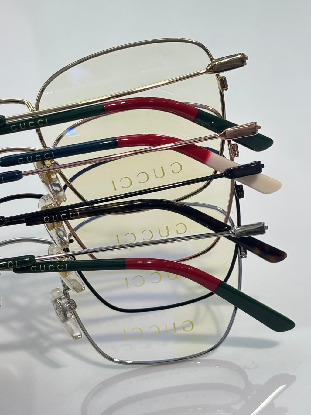 Gucci optical glasses set, mixed green and red striped temples, clear lenses