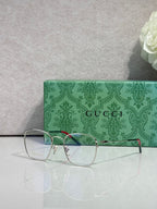 Gucci optical glasses with green frame, gold temples, clear lenses