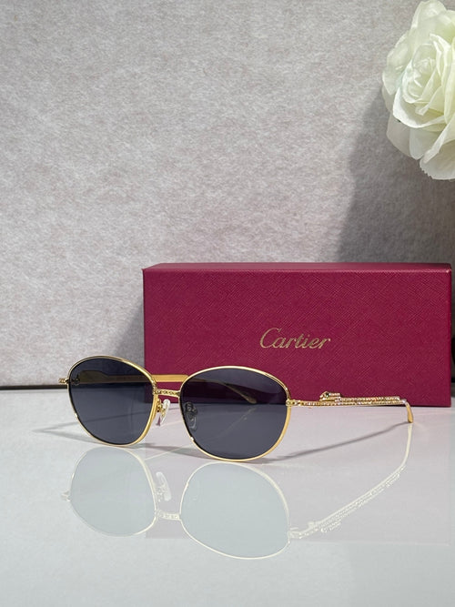 Gold-tone round glasses with dark lenses and gold hinge detail