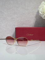 Gold-tone round glasses with rose-tinted lenses and delicate bridge