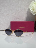 Gold-tone round sunglasses with dark tinted lenses and thin metal frame