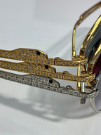 Gold-tone eyeglass frame with rhinestone-embellished temples and hinge details