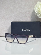 Chanel eyeglasses, dark blue square frames, clear lenses, gold logo on temple