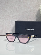 Chanel glasses with dark purple frames and pink gradient lenses, gold CC logo detail