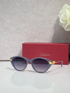 Cartier sunglasses with dark round frames, gold-tone accents, and light violet-tinted lenses