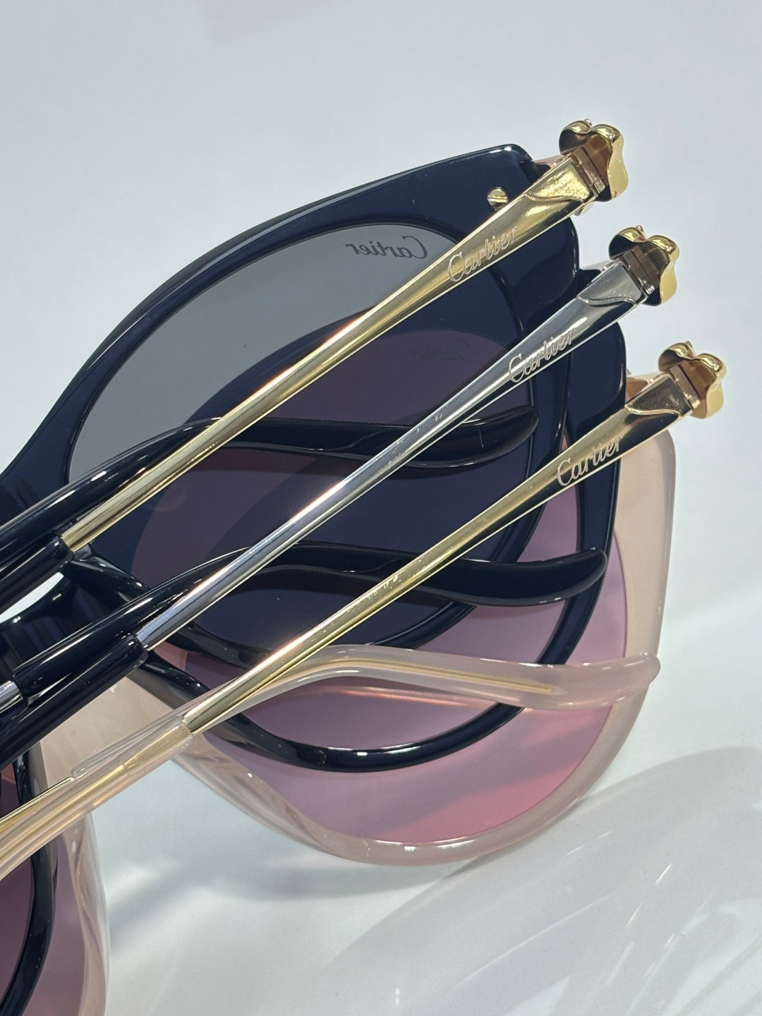 Cartier sunglasses close-up of gold-tone temples and dark tinted lenses