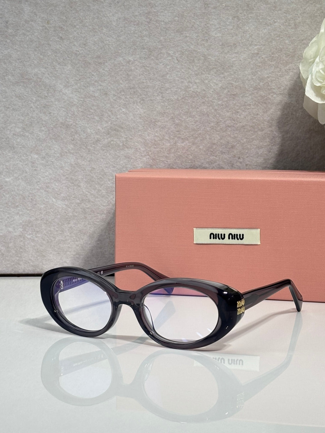Miu Miu eyeglasses, dark tortoiseshell oval frames, side profile