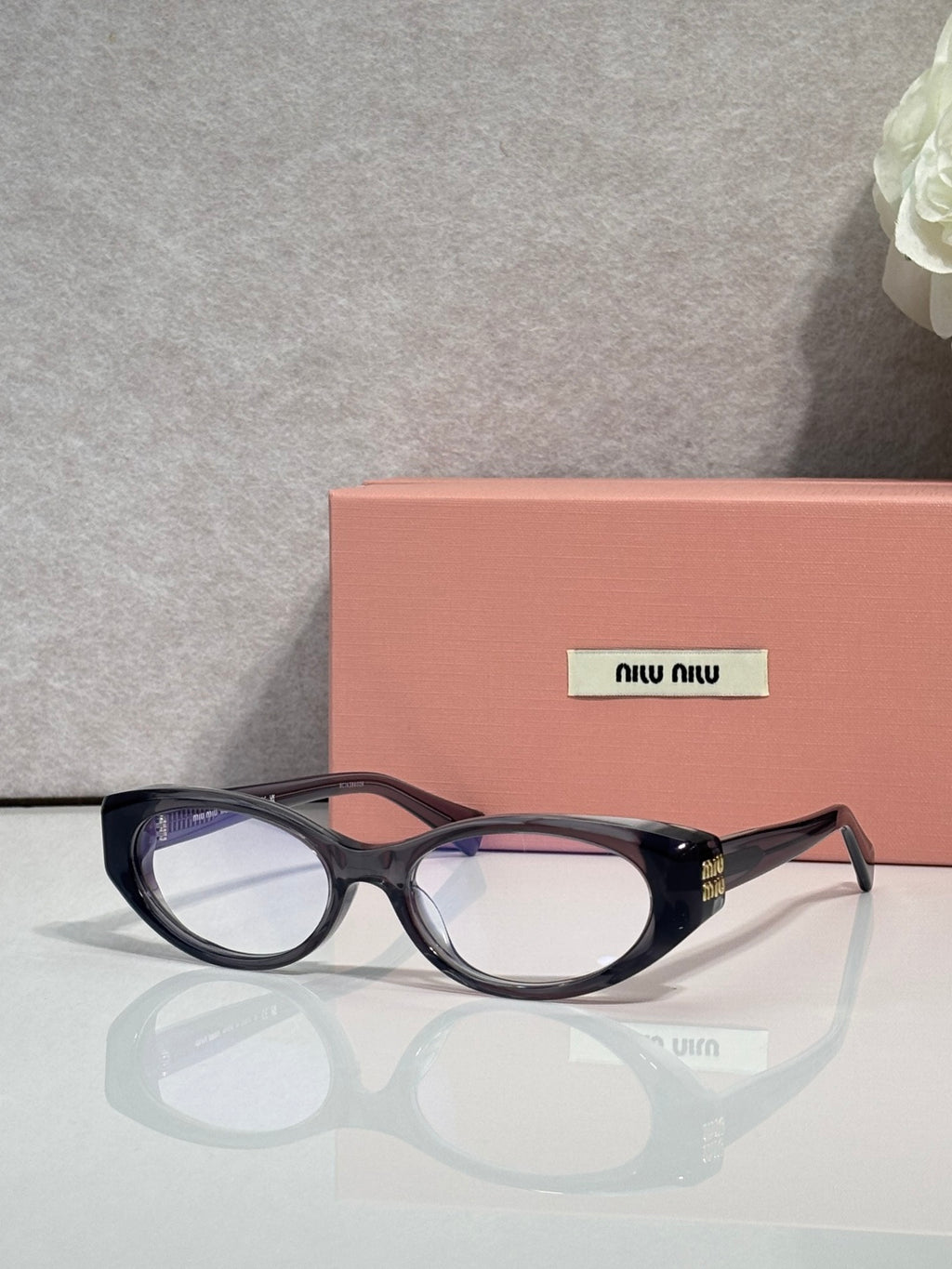 MiuMiu eyeglasses in dark tortoiseshell, clear lenses with bridge and metal hinge detail