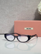 MiuMiu eyeglasses in dark tortoiseshell, clear lenses with bridge and metal hinge detail