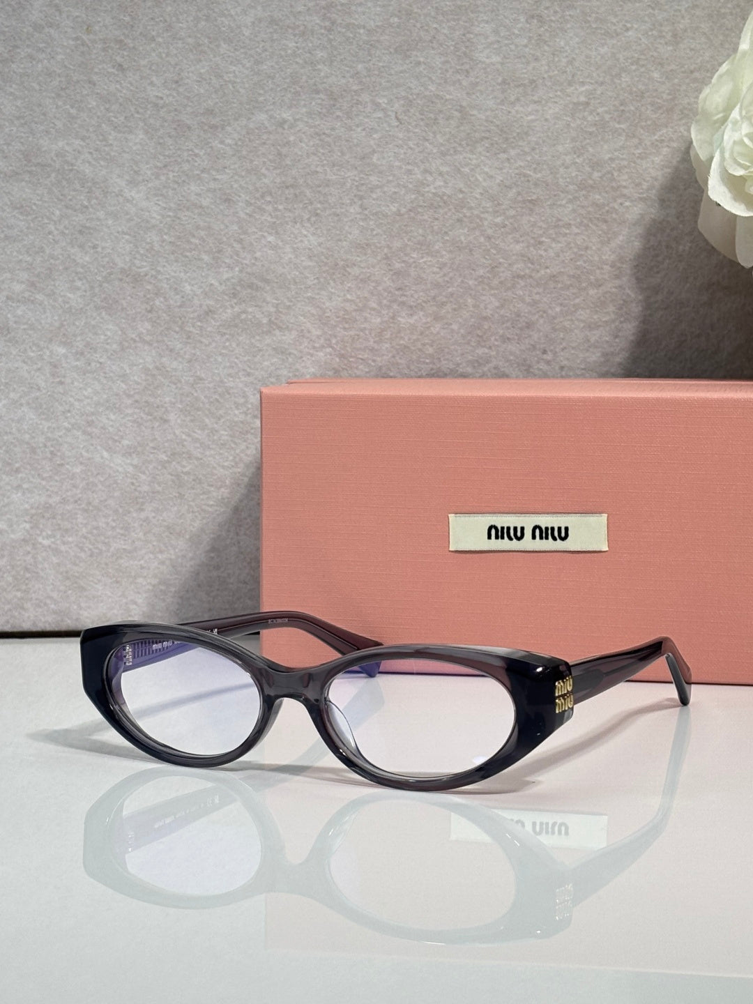 MiuMiu eyeglasses in dark tortoiseshell, clear lenses with bridge and metal hinge detail
