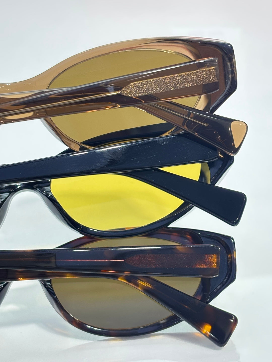 Tortoiseshell sunglasses with yellow lenses, stacked view