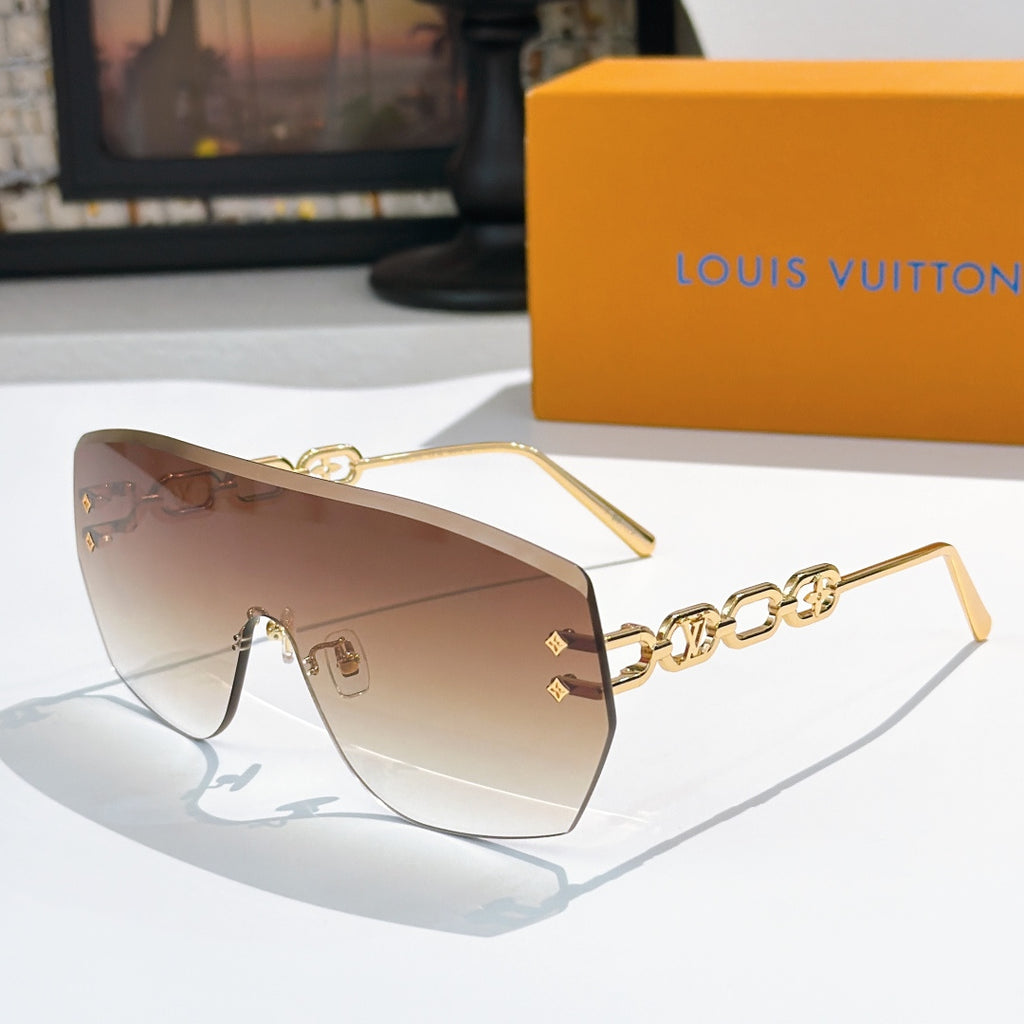Louis Vuitton sunglasses with brown gradient lenses and gold chain detail frames