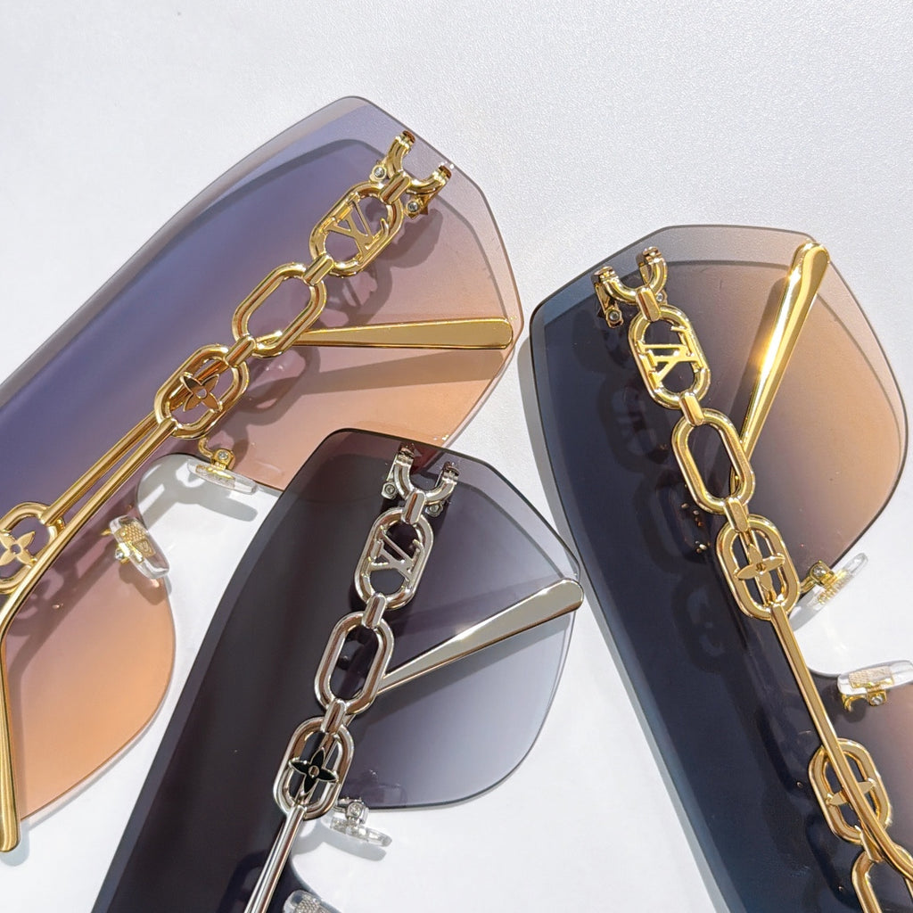 Louis Vuitton sunglasses close-up set with gold chain frames and tinted lenses